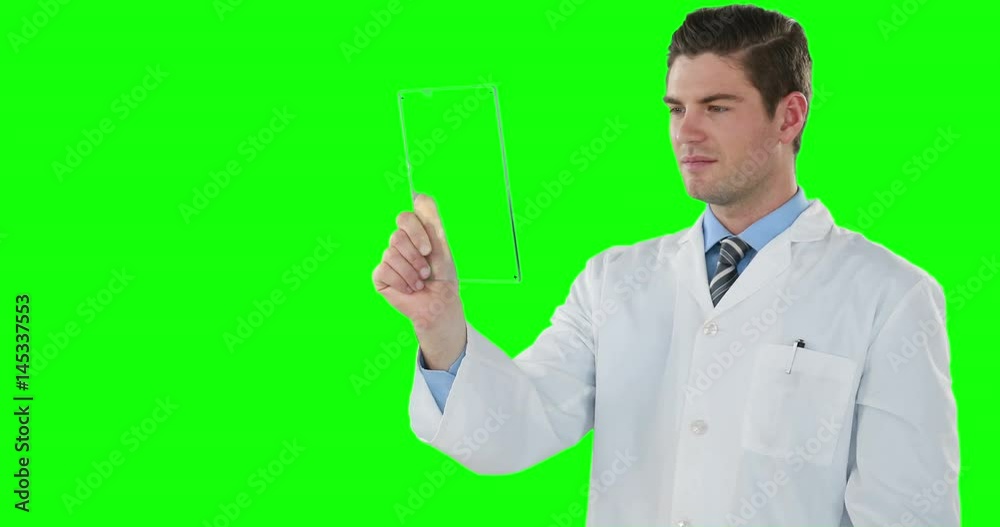 Doctor using futuristic tablet Doctor using futuristic tablet
