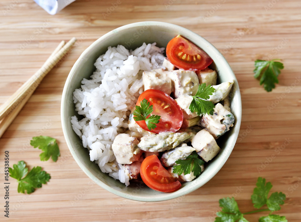 Delicious tofu dish with fresh tomatoes and green asparagus. High angle view. Vegetarian food. Delicious tofu dish with fresh tomatoes and green asparagus. High angle view. Vegetarian food.