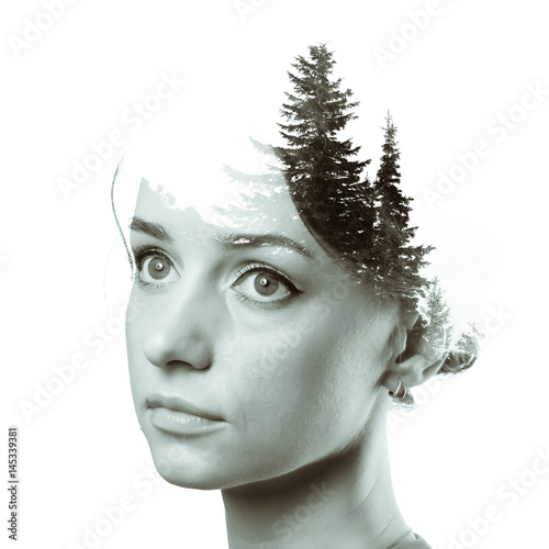 Fototapeta Naklejka Na Ścianę i Meble -  Double exposure black and white toned portrait of woman and pine forest