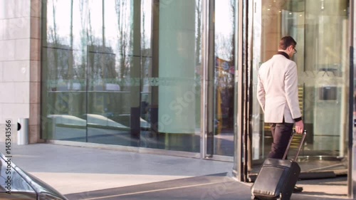 Attractive businessman arriving to hotel