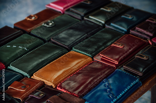 Handmade leather wallets for sale in the family shop.