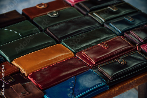 Handmade leather wallets for sale in the family shop.