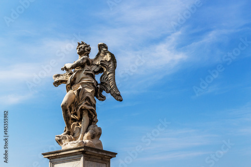 A color photo of one of the famous angel sculptures at Castel Sant Angelo in Rome  Italy. 