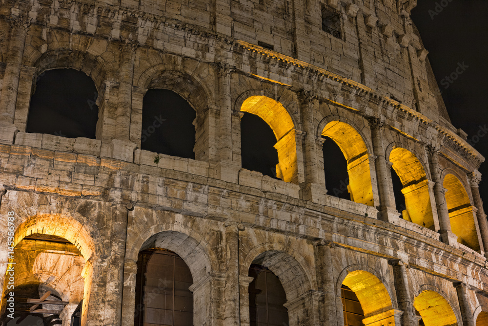 Colosseum at night- the main tourist attractions of Rome, Italy. Ancient Rome Ruins of Roman Civilization.