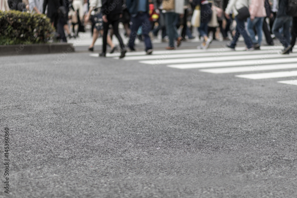 people crossing at a pedestrian crossing