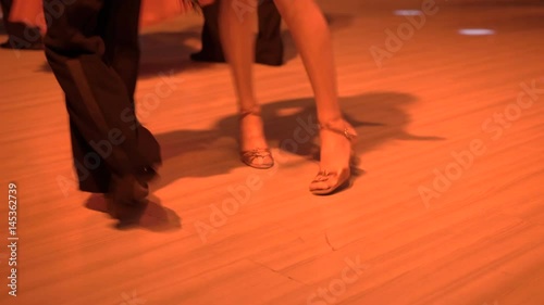 Lower look of dancer's couple in chic dresses in 4K photo