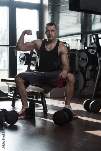 Athlete Posing With Supplements For Copy Space