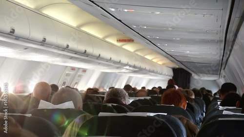 The cabin of the plane with passengers, HD 1080p photo