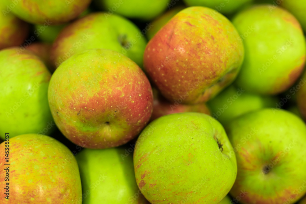 Background of apples on sale at the local organic market of tropical Bali island, Indonesia. Background of apples on sale at the local organic market of tropical Bali island, Indonesia.