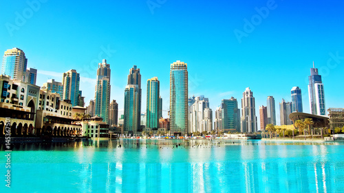 Downtown Dubai skyline, panoramic view from the Dubai fountain. Modern city cityscape with skyscrapers, sunny day. © alexialex
