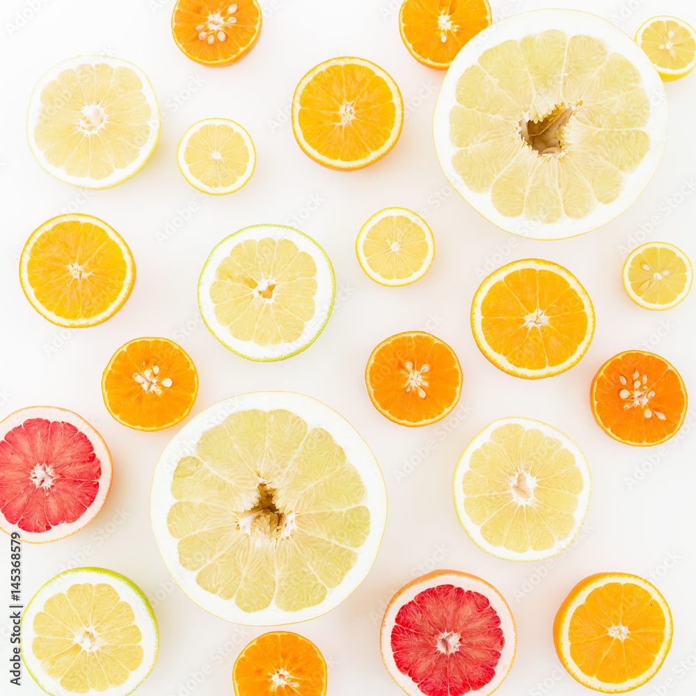 Food print of fresh citrus fruits on white background. Flat lay, top view.