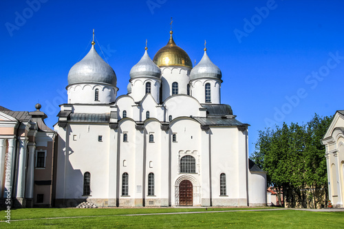 Ancient white temple with golden domes in Russia