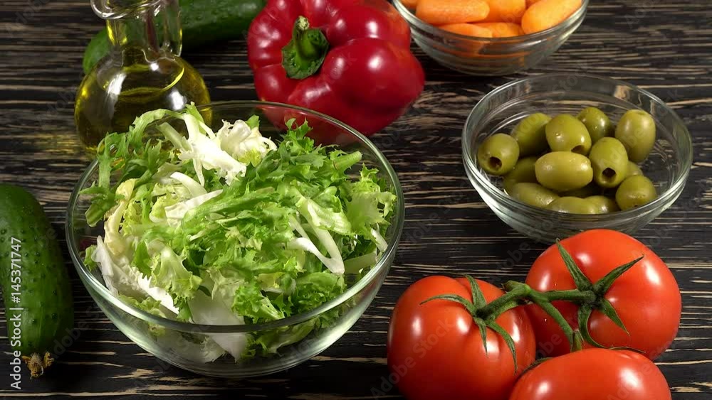 Vegetables ingridients for salad on rustic wooden background. Vegetables ingridients for salad on rustic wooden background.