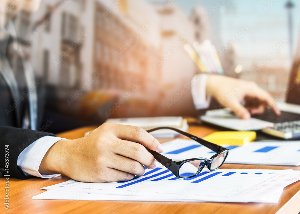 Φωτογραφία Double exposure of a businessman holding eyeglasses and  other hand touching on