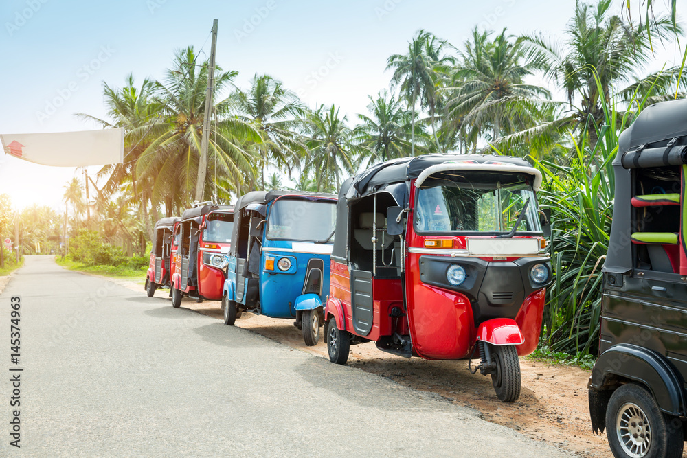 Tuktuk taxi on road of Sri Lanka Ceylon travel car