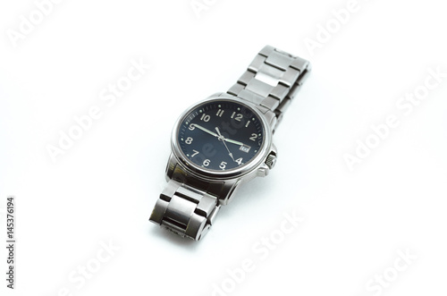 Modern steel watch with black dial isolated on white background.