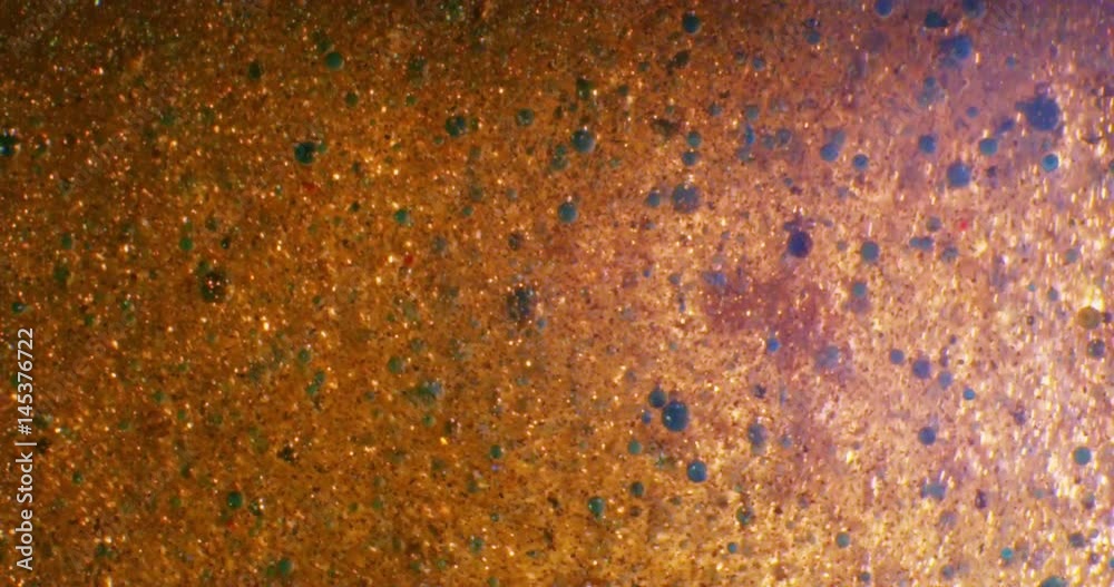 Gold Liquid. Color drops floating in oil and water over a colorful underground with oil painting effect. 4K.
Gold Liquid. Color drops floating in oil and water over a colorful underground with oil painting effect. 4K.