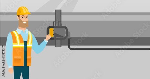 Operator checking detector on gas pipeline.