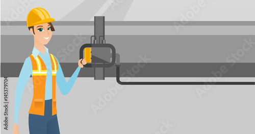 Operator checking detector on gas pipeline.