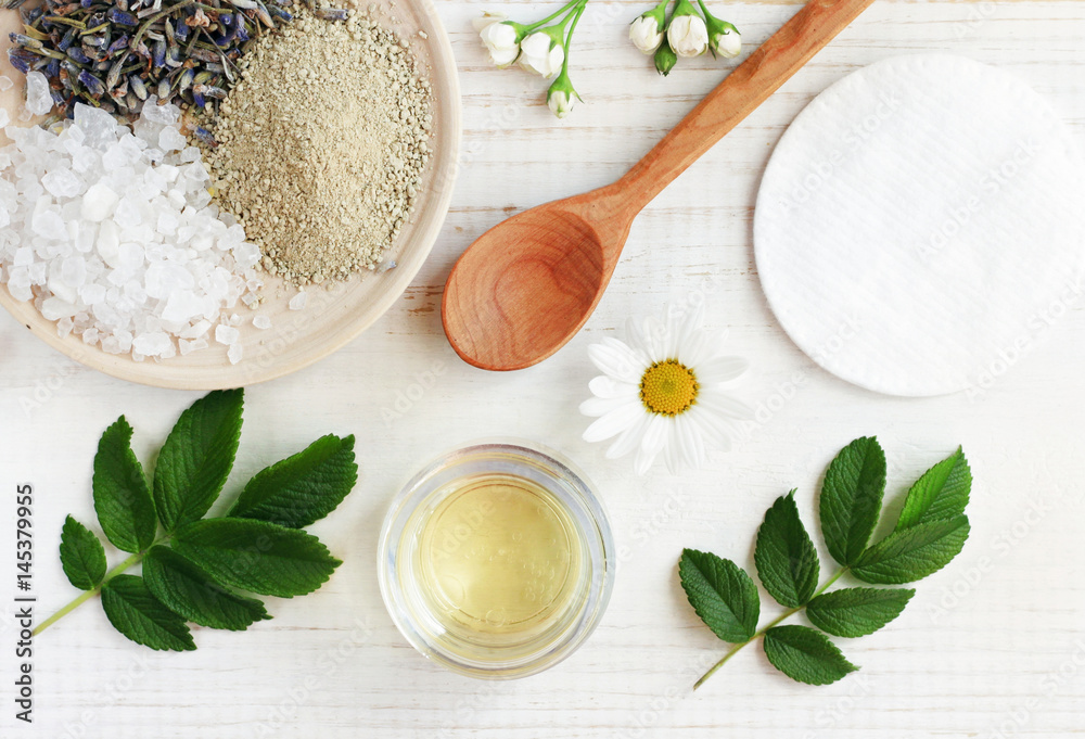 Natural herbal skin care products, top view ingredients. Cosmetic oil,  clay, sea salt, herbs, plant leaves. Facial treatment preparation  background. Stock Photo | Adobe Stock