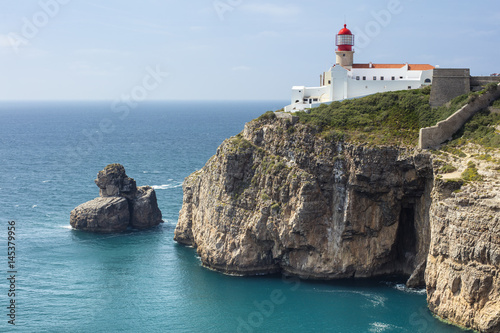 lighthouse and rock in the sea