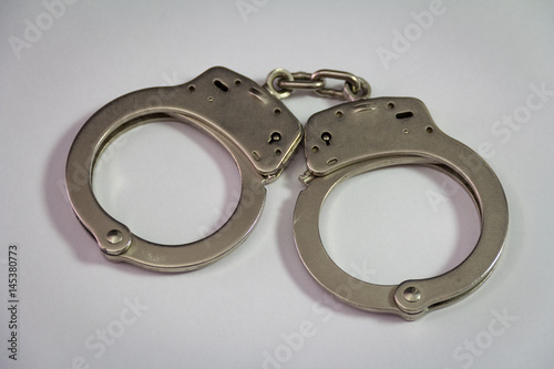 Police handcuffs isolated on white background