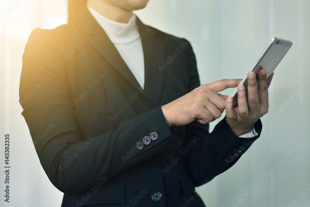 Business woman she is using the internet on smart phone. Business woman she is using the internet on smart phone.
