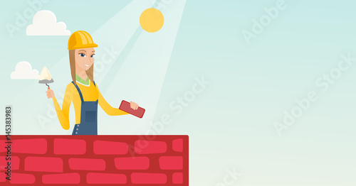 Bricklayer working with spatula and brick.