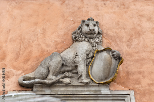 Lion bas relief on the building wall in Warsaw, Poland.
