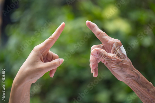 Old and young hands. © patcharaporn1984