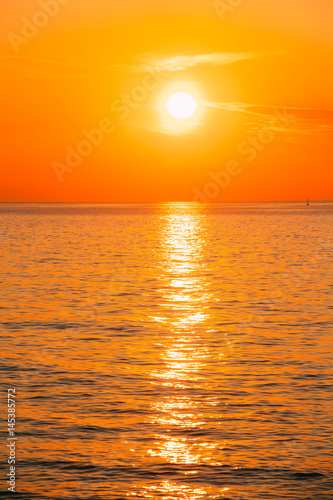 Sun Is Setting On Horizon At Sunset Sunrise Over Sea Or Ocean.