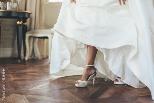 Wedding bride shoes. Beautiful legs