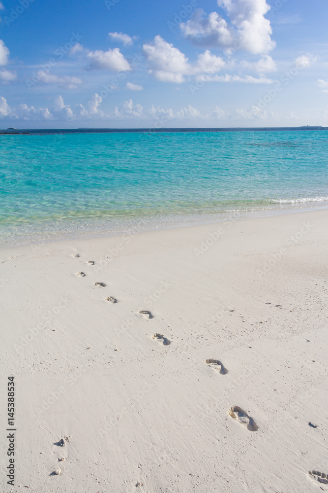 Tropical sand beach and blue sky with white clouds Tropical sand beach and blue sky with white clouds