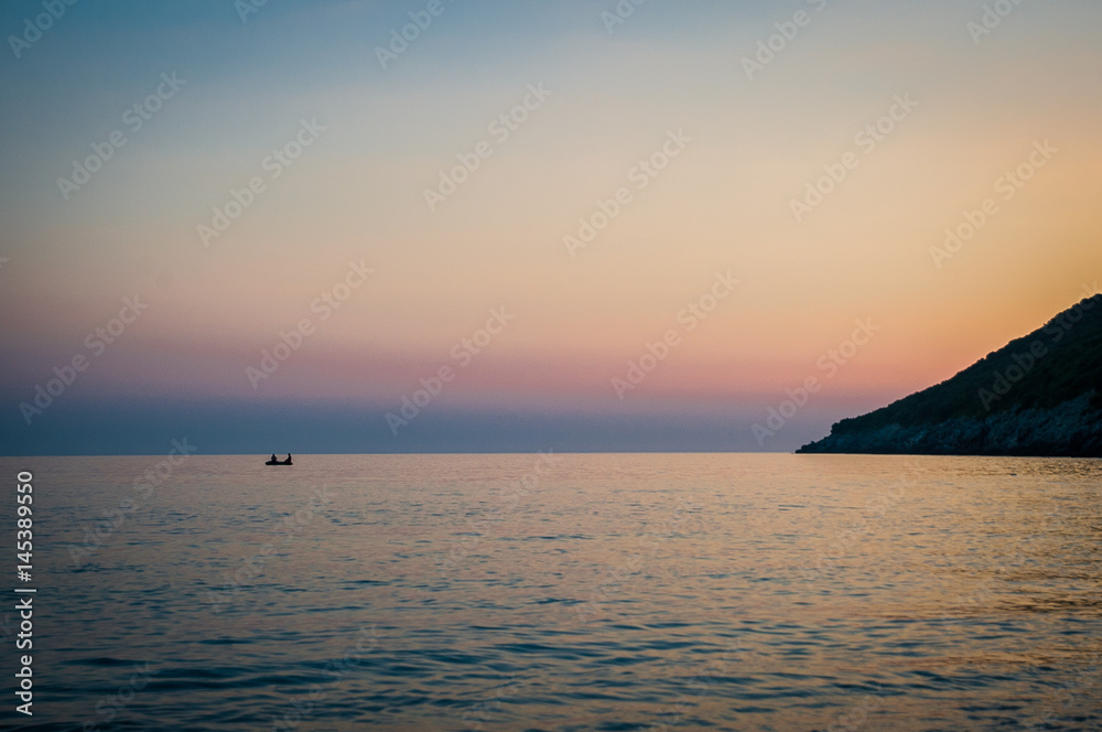 2016 Albania sunset on the beach. Beautiful afternoon sun hiding behind horizon