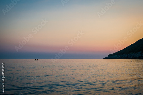 Obraz na płótnie 2016 Albania sunset on the beach. Beautiful afternoon sun hiding behind horizon w salonie