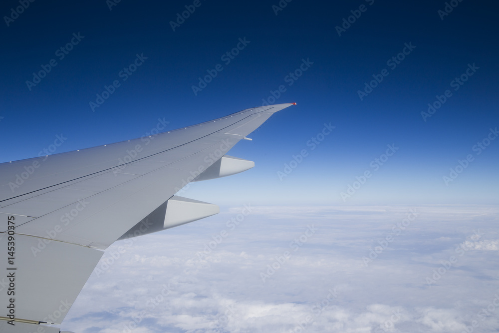 Beautiful blue sky background with wing aircraft