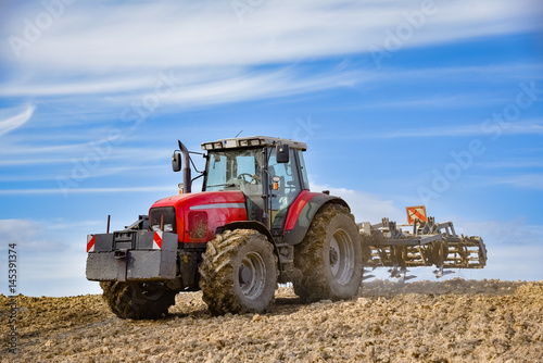 Fotografie Cultivation of soil for the next grain cultivation