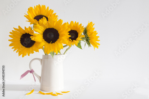 Yellow Sunflowers in a cream jug