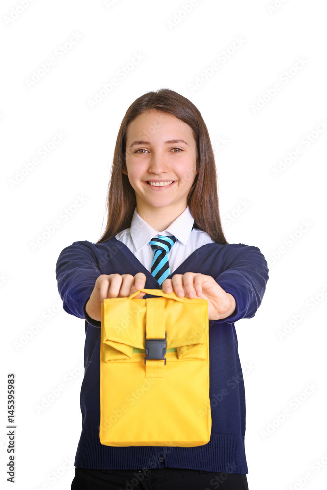 Cute schoolgirl with lunch bag on white background Cute schoolgirl with lunch bag on white background