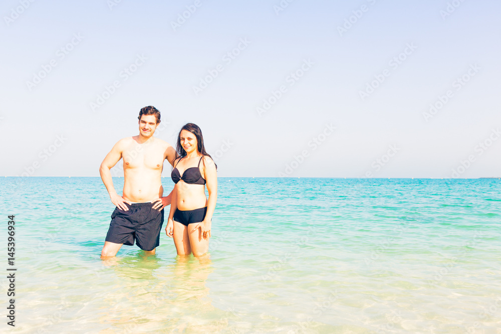 Tourists Standing In The Water