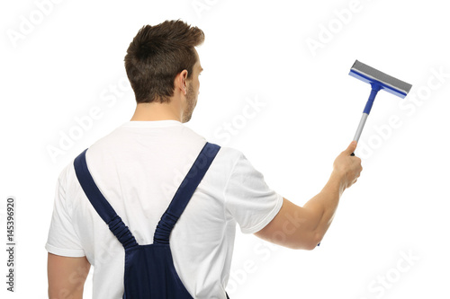 Young window cleaner on whi...