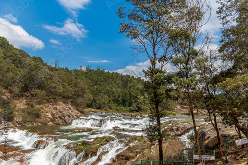 People at Pykara waterfall, Ooty, India - March 14, 2016: Pykara waterfalls flows through Murkurti, Pykara and Glen Morgan dams