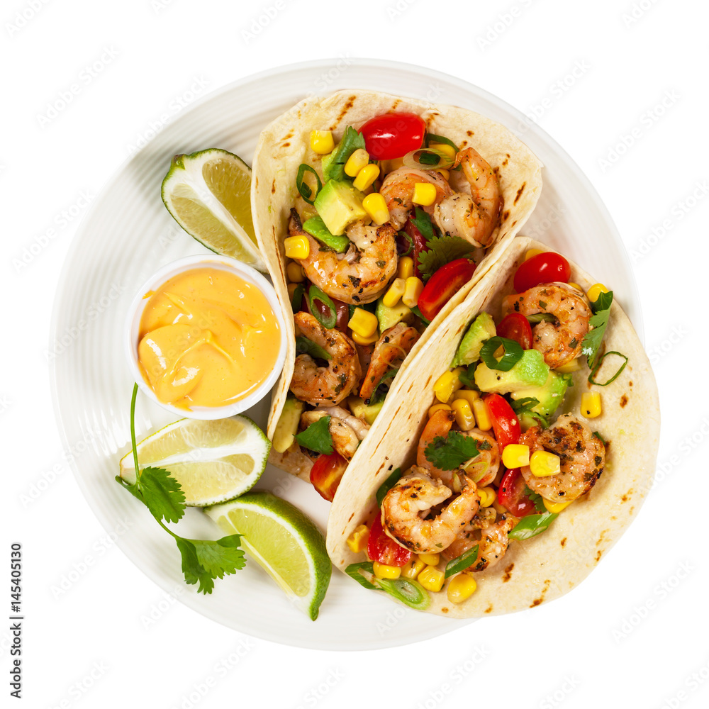 Fototapeta premium Shrimp Tacos with Corn and Avocado Salsa Isolated on White background. Selective focus.