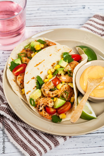 Shrimp Tacos with Corn and Avocado Salsa Panoramic image. Selective.