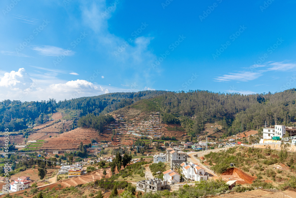Wide view of houses built on a mountain, Ooty, India, 19 Aug 2016