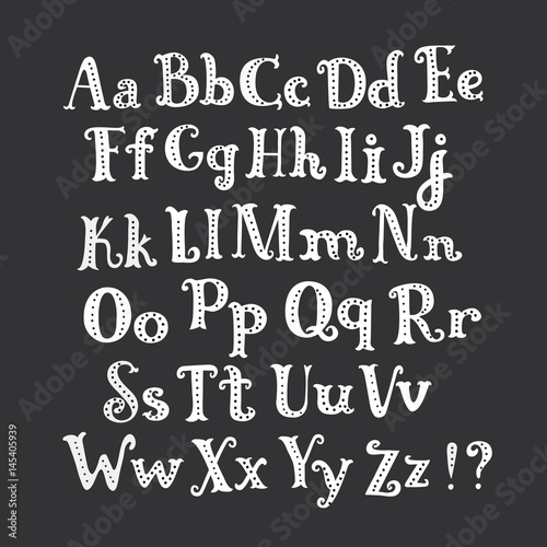 Halloween chalk roman alphabet. White hand-drawn letters set on dark background. Funny decorations of bats and pumpkin.