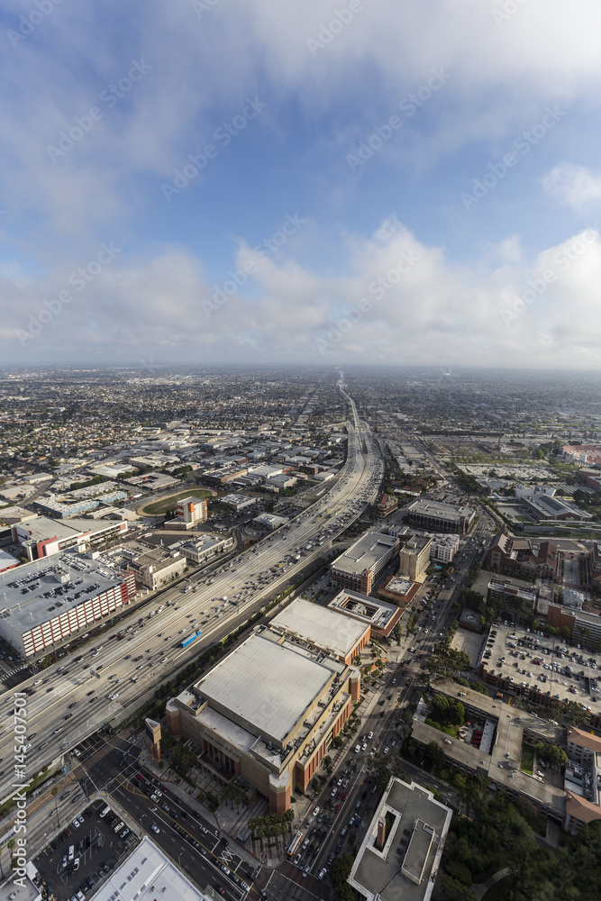 Aerial view of Harbor 110 Freeway with afternoon clouds in Los Angeles, California.  