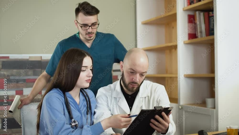 medical team are discussing with x-rays at hospital office consultation. 3 person doctor and nurse 4k medical team are discussing with x-rays at hospital office consultation. 3 person doctor and nurse 4k