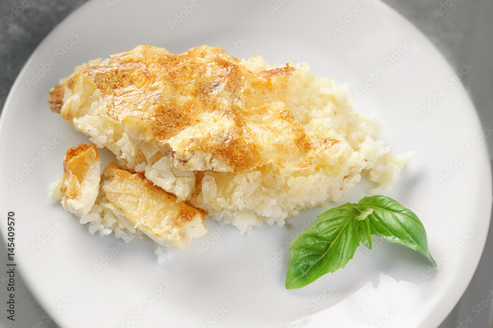 Delicious cooked chicken and rice on white plate