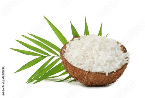 Grated coconut in shell on white background